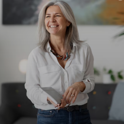 Smiling woman holding a mobile phone